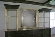 Architect: Kirchhoff & Associates. Polished brass etageres and mirror with glass.