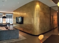 Architect: Robert A. M. Stern. Textured brass panels