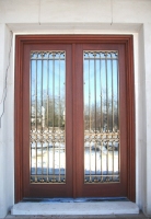 Architect: Nicholas Cusano. Bronze door grille.