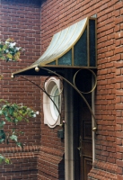 Architect: Anthony Cohn. Bronze and copper canopy.
