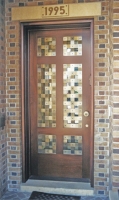 Architect: Ike & Kliggerman. Bronze door grille.