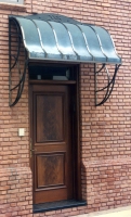 Architect: Anthony Cohn. Bronze and copper canopy.