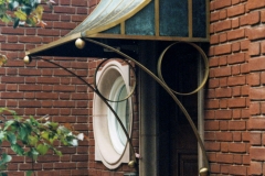 Architect: Anthony Cohn. Bronze and copper canopy.