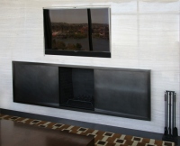 Designer: Pembrooke & Ives. Bronze fireplace surround.