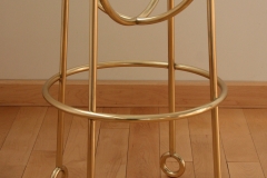 Architect: Ike Kliggerman & Barkley. Polished brass stool.