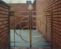 Architect: Anthony Cohn. Bronze gates.