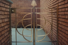 Architect: Anthony Cohn. Bronze gates.