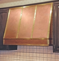 Architect: Ike &amp; Kliggerman. Brass and copper range hood.