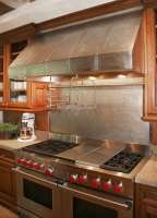 Architect: Arthur Chabon. Cupro-Nickel range hood and backspash.